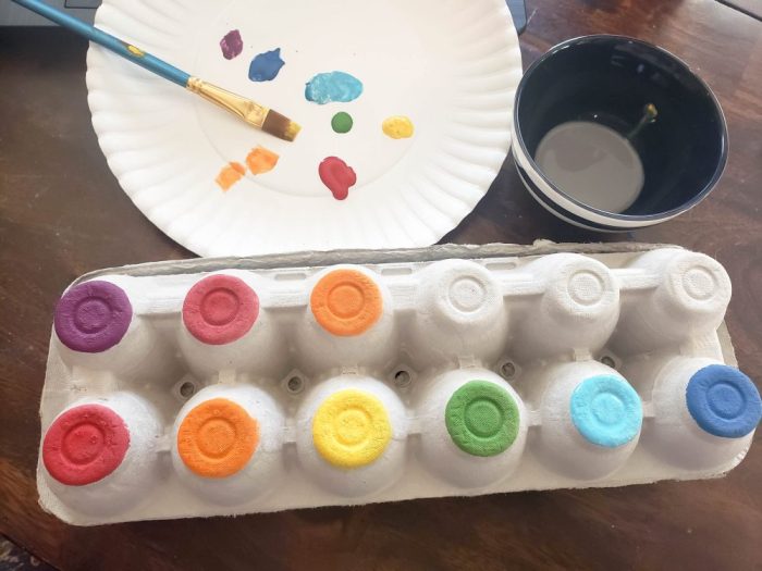 Painting an egg carton to make into a xylophone for fun with singing time