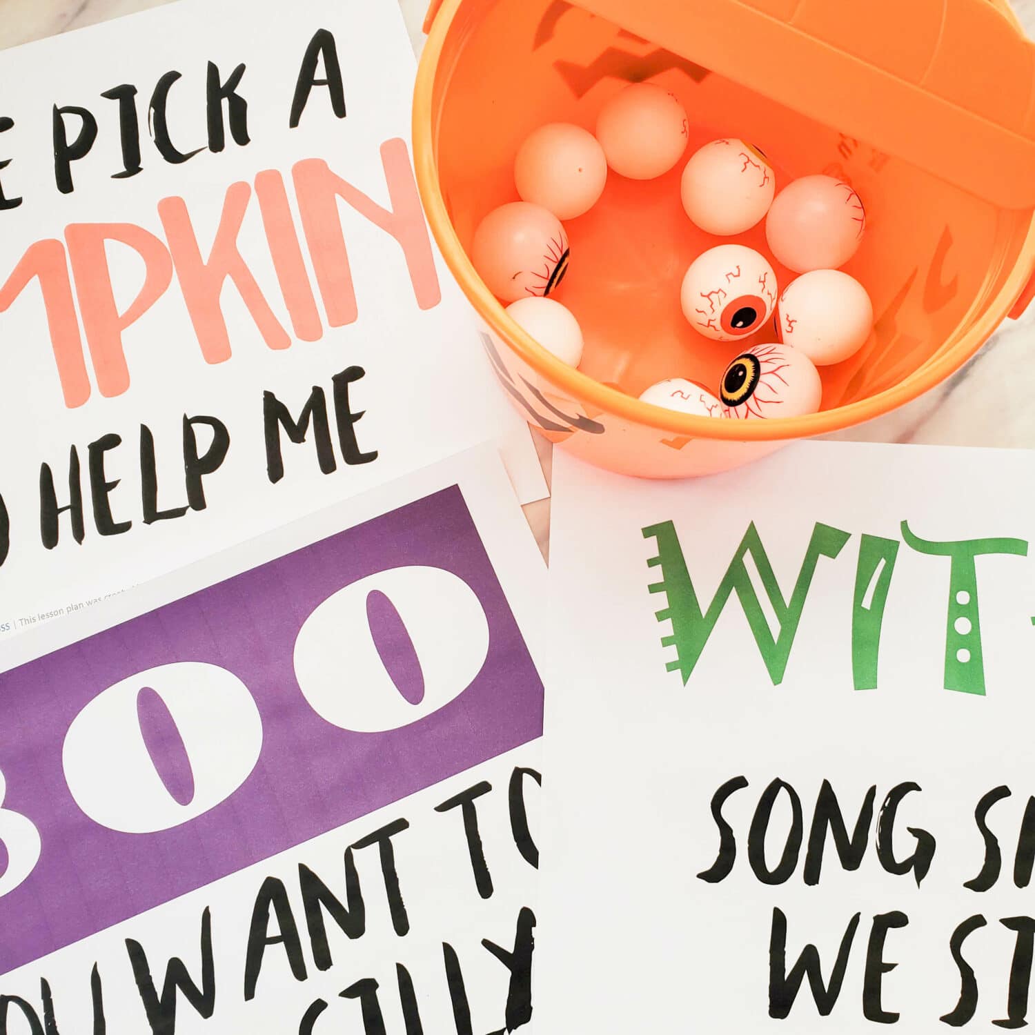 Halloween Bucket Toss Singing Time game with cute ways to pick out Primary songs to sing and even a gross texture fun idea to mix it up! LDS Primary Music Leader singing time ideas with printable song helps.