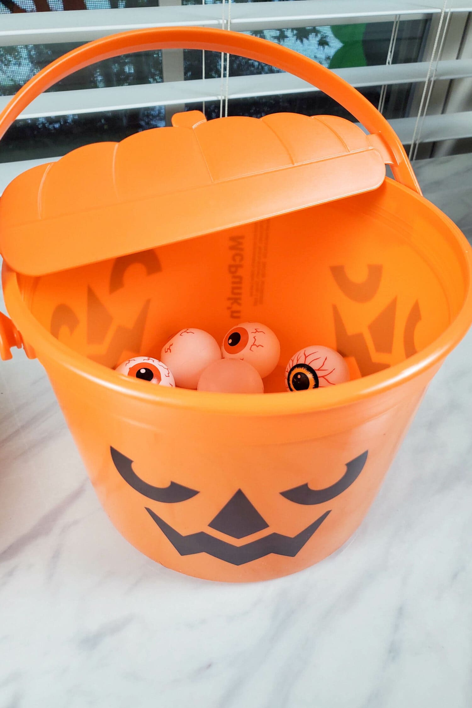 Halloween Bucket Toss Singing Time game with cute ways to pick out Primary songs to sing and even a gross texture fun idea to mix it up! LDS Primary Music Leader singing time ideas with printable song helps.