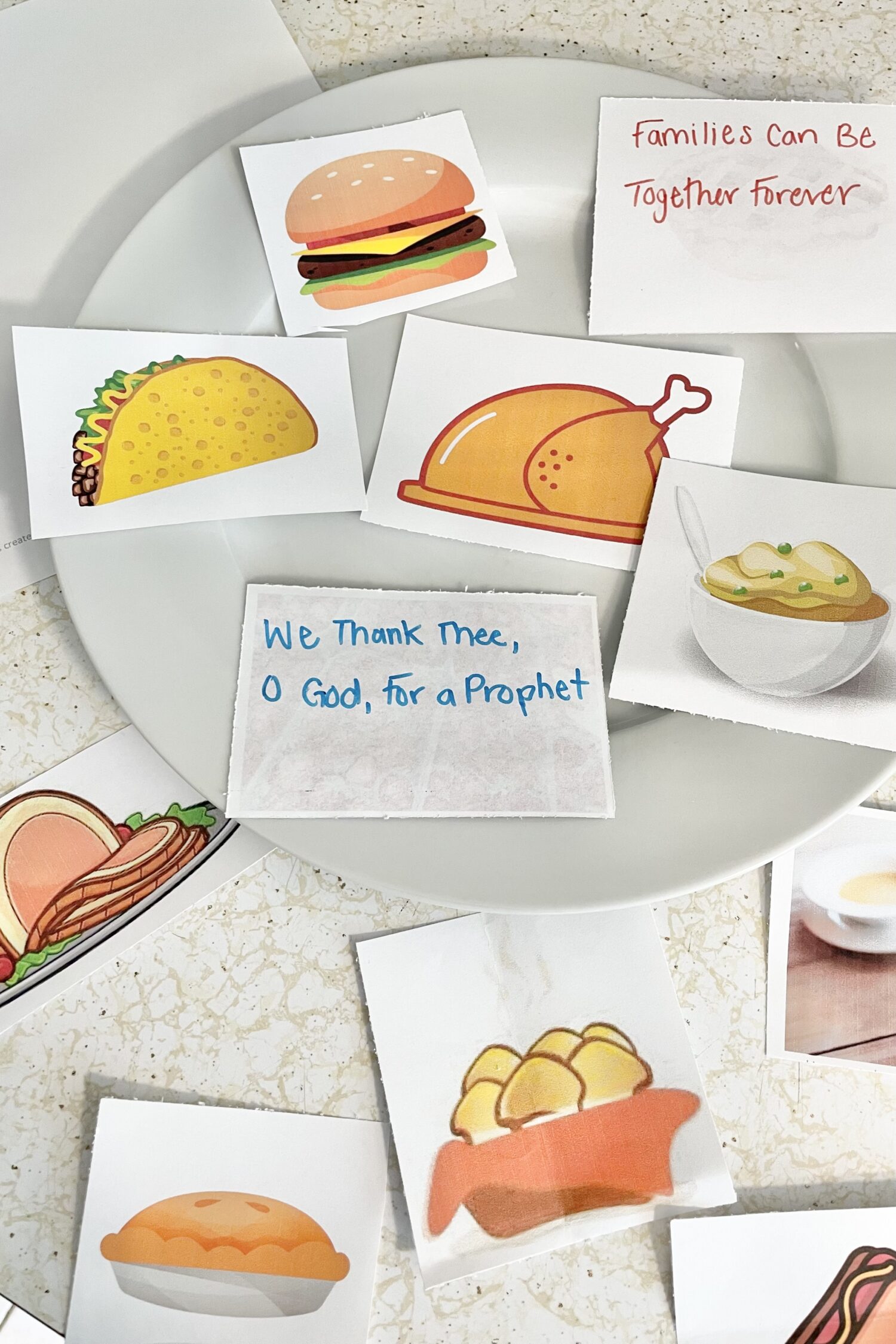 This FUN Thanksgiving Feast Primary Idea is a cute way to review primary songs during November! Bring in pictures of favorite Thanksgiving foods with songs written on the back. Add items to your plate as you review! Printable singing time ideas for LDS Primary Music Leaders.