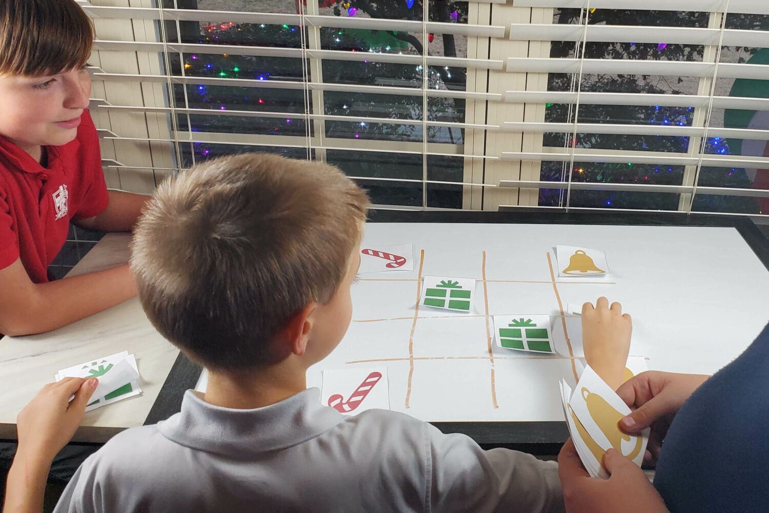 Christmas Tic Tac Toe - A fun 3 player Tic Tac Toe (or 3 teams) with symbols for the shepherds, angels, and wise men and lots of repetition for a single song, mix of songs, or 3 Christmas songs of your choice! Fun singing time idea or printable game for families.