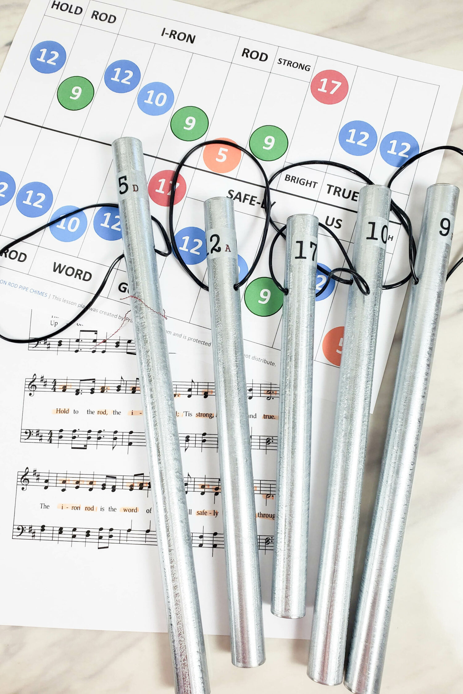 The Iron Rod Pipe Chimes chart singing time idea! Head over to grab this printable chime charts to help teach the hymn The Iron Rod in your Primary room! Great tie in to the theme of the song with these metal pipe chimes as an engaging activity for your kiddos.