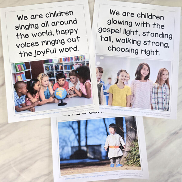 Holding Hands Around the World Picture the Children 1 Holding Hands Around the World Picture the Children - Start with the lyrics face up, then flip them over as you go to pictures of children from all over the world! Fun and easy singing time idea and lesson plan for LDS Primary music leaders.