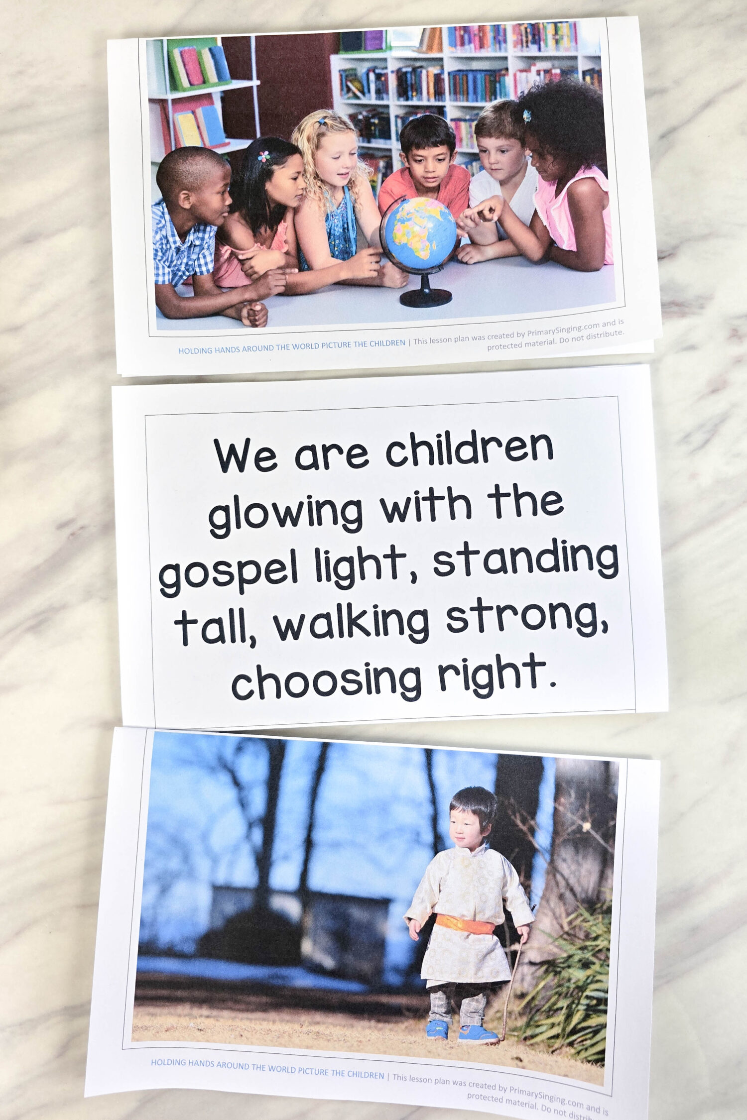 Holding Hands Around the World Picture the Children - Start with the lyrics face up, then flip them over as you go to pictures of children from all over the world! Fun and easy singing time idea and lesson plan for LDS Primary music leaders.